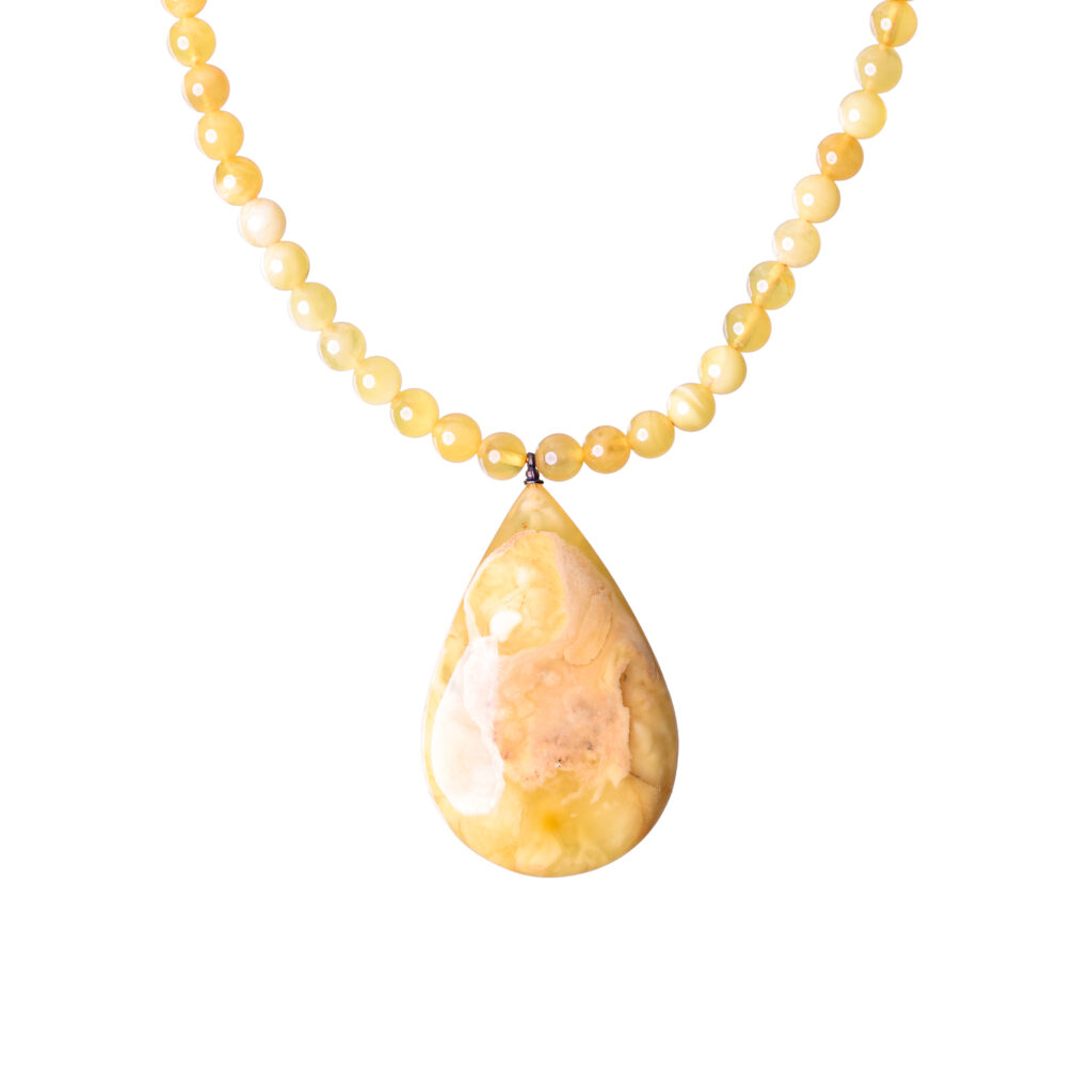 Butter color amber necklace with a unique pendant