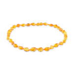 Honey color amber necklace with curve shape beads