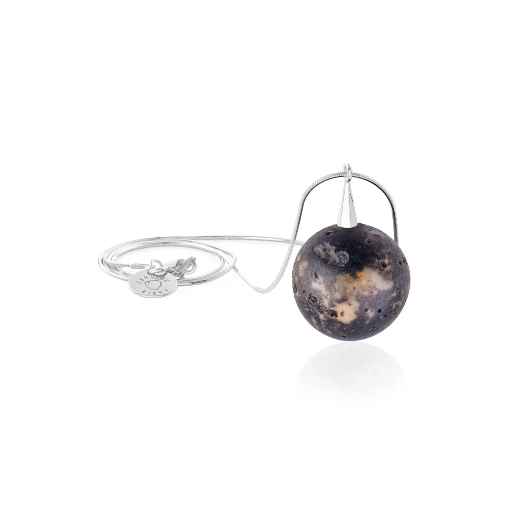 Amber sphere pendant earth colors on a silver chain